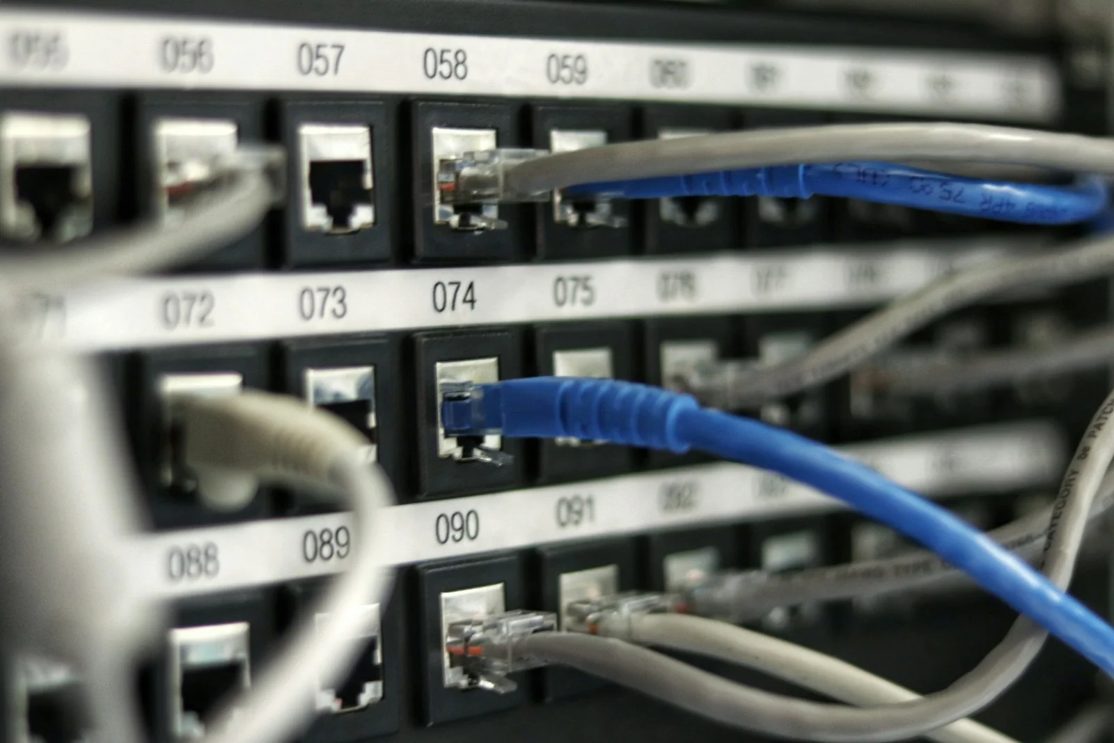 Structured Cat6A copper patch panels and fiber optic backbone cabling rack